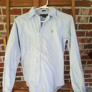 Like new, light blue collared polo shirt